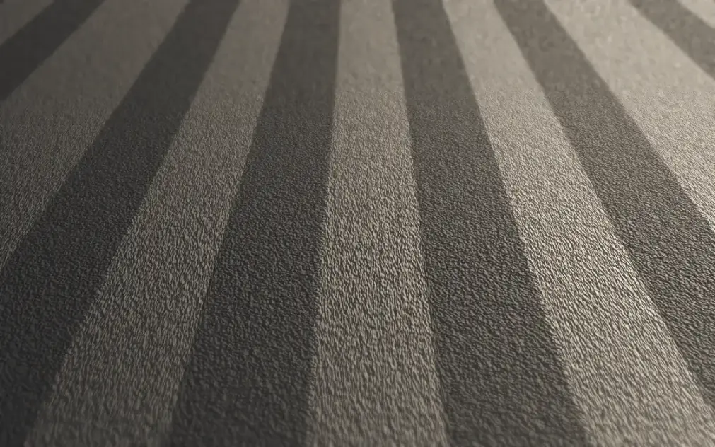 Groomed carpet lanes alternating light and dark with the direction of the nap